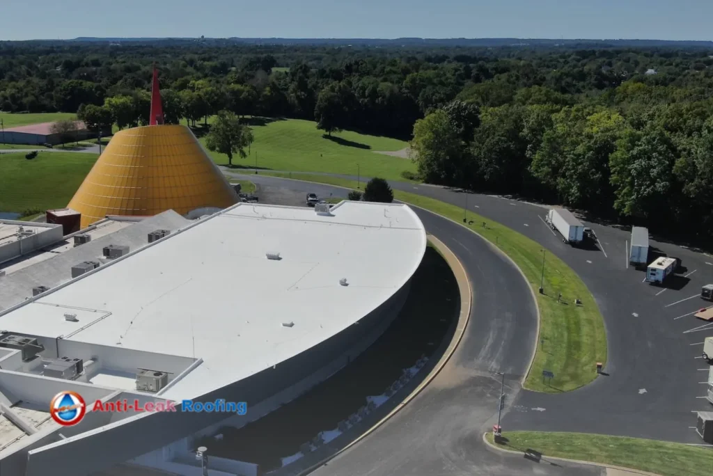 An aerial view of a building with a yellow roof.